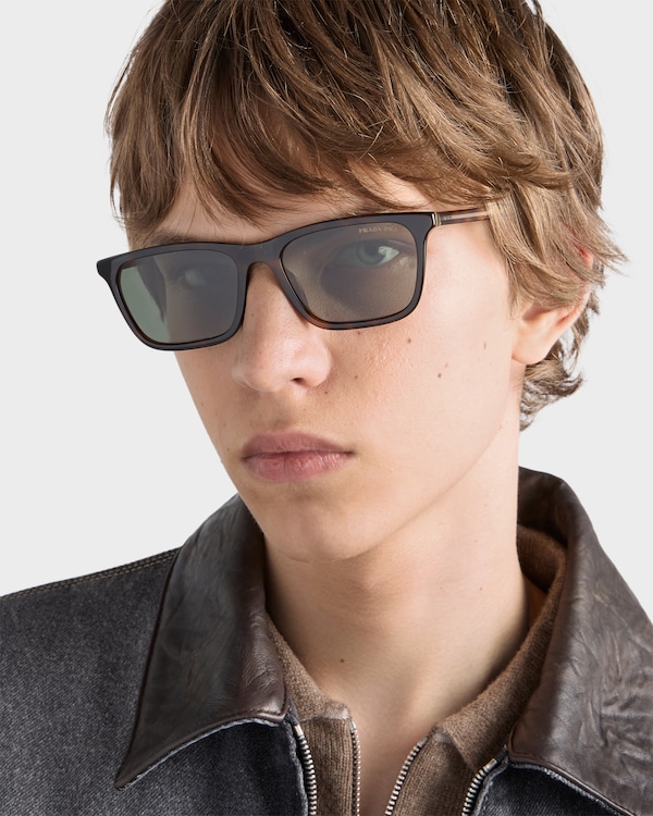 Prada sunglasses with the iconic metal plaque - Polarized bottle green lenses Prada sunglasses with the iconic metal plaque - Polarized bottle green lenses