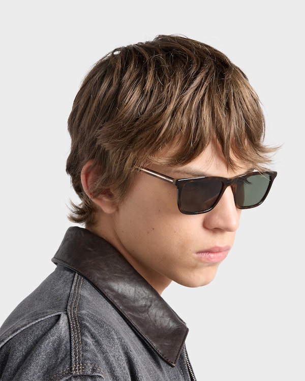 Prada sunglasses with the iconic metal plaque - Polarized bottle green lenses Prada sunglasses with the iconic metal plaque - Polarized bottle green lenses