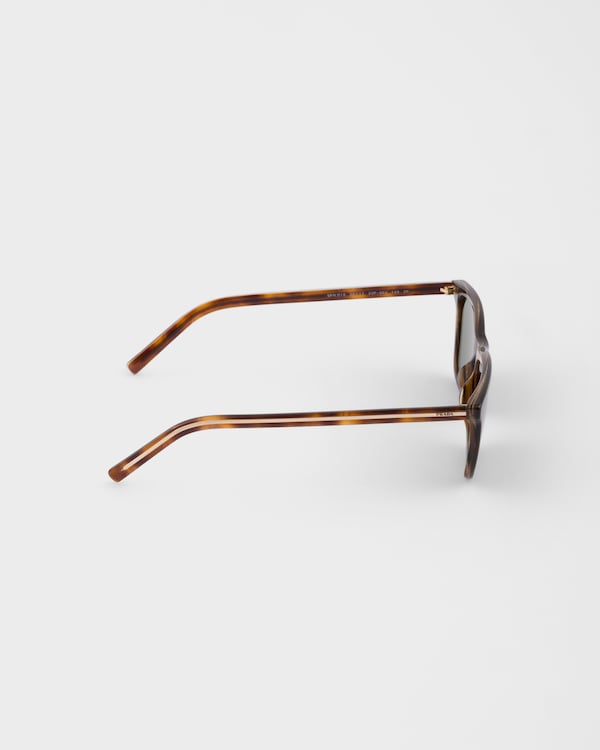 Prada sunglasses with the iconic metal plaque - Polarized bottle green lenses Prada sunglasses with the iconic metal plaque - Polarized bottle green lenses