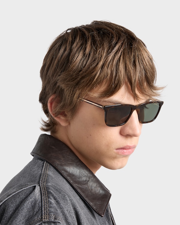 Prada sunglasses with the iconic metal plaque - Polarized bottle green lenses Prada sunglasses with the iconic metal plaque - Polarized bottle green lenses