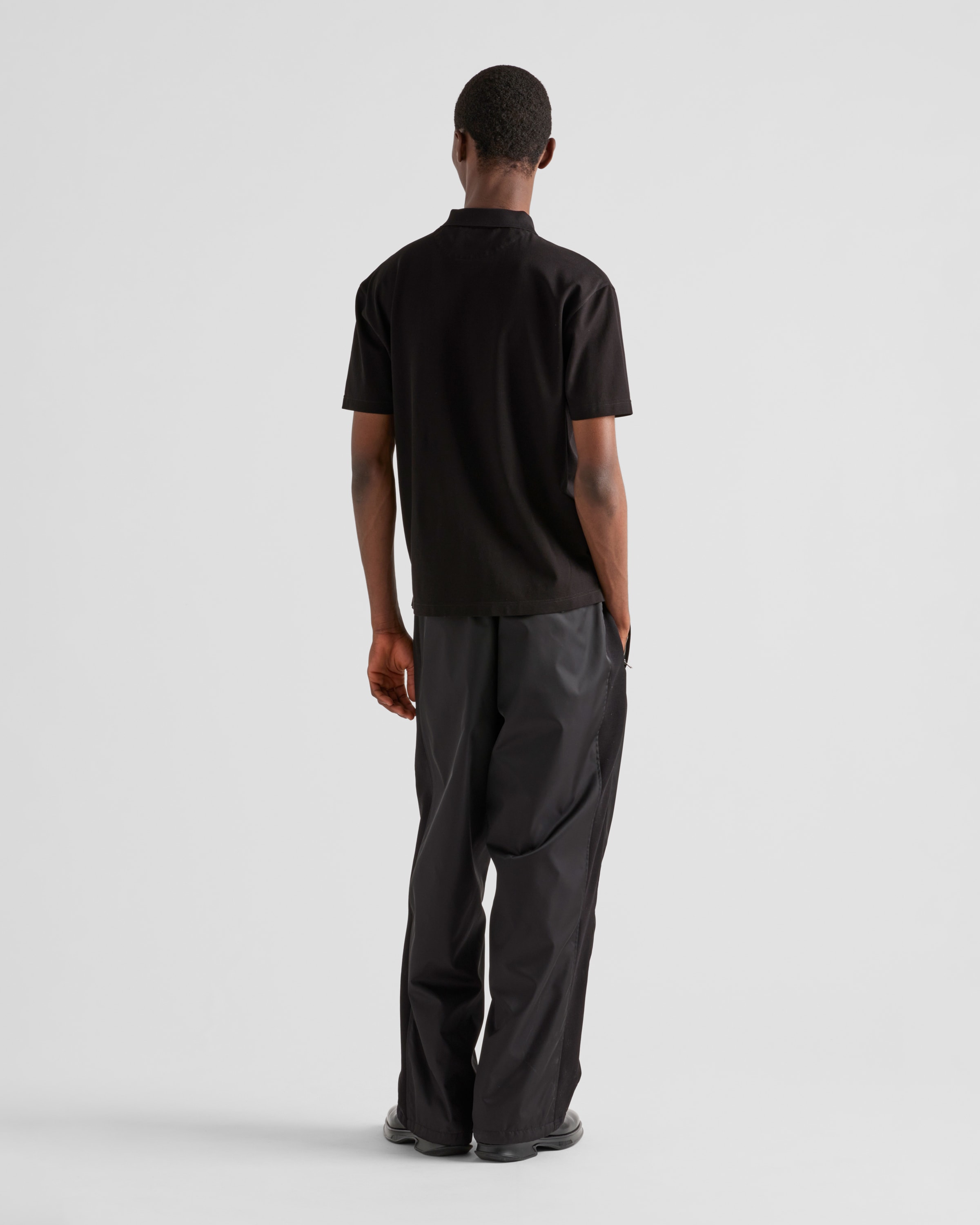 Black Piqué polo shirt with Re-Nylon details | PRADA - United States
