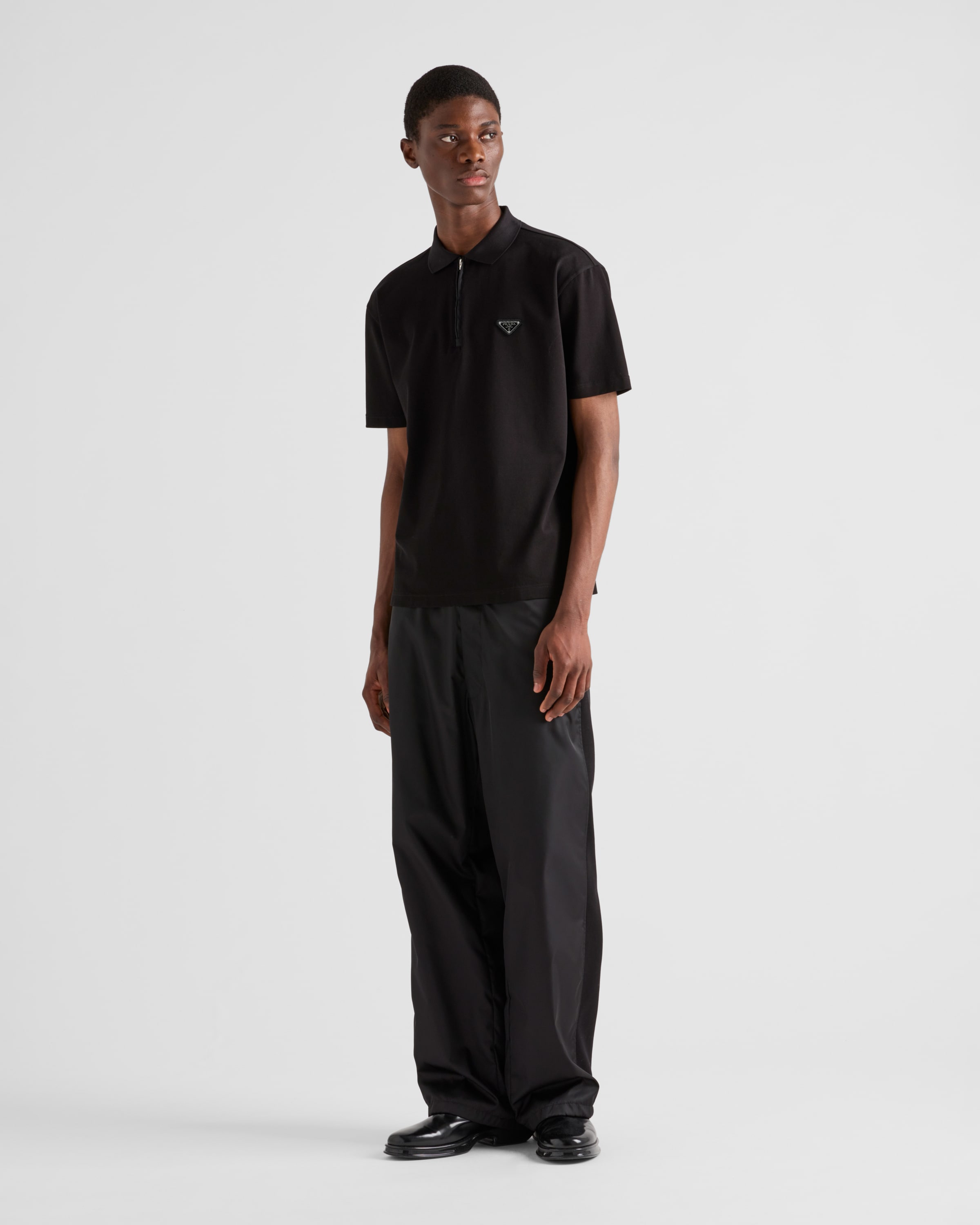 Black Piqué polo shirt with Re-Nylon details | PRADA - United States