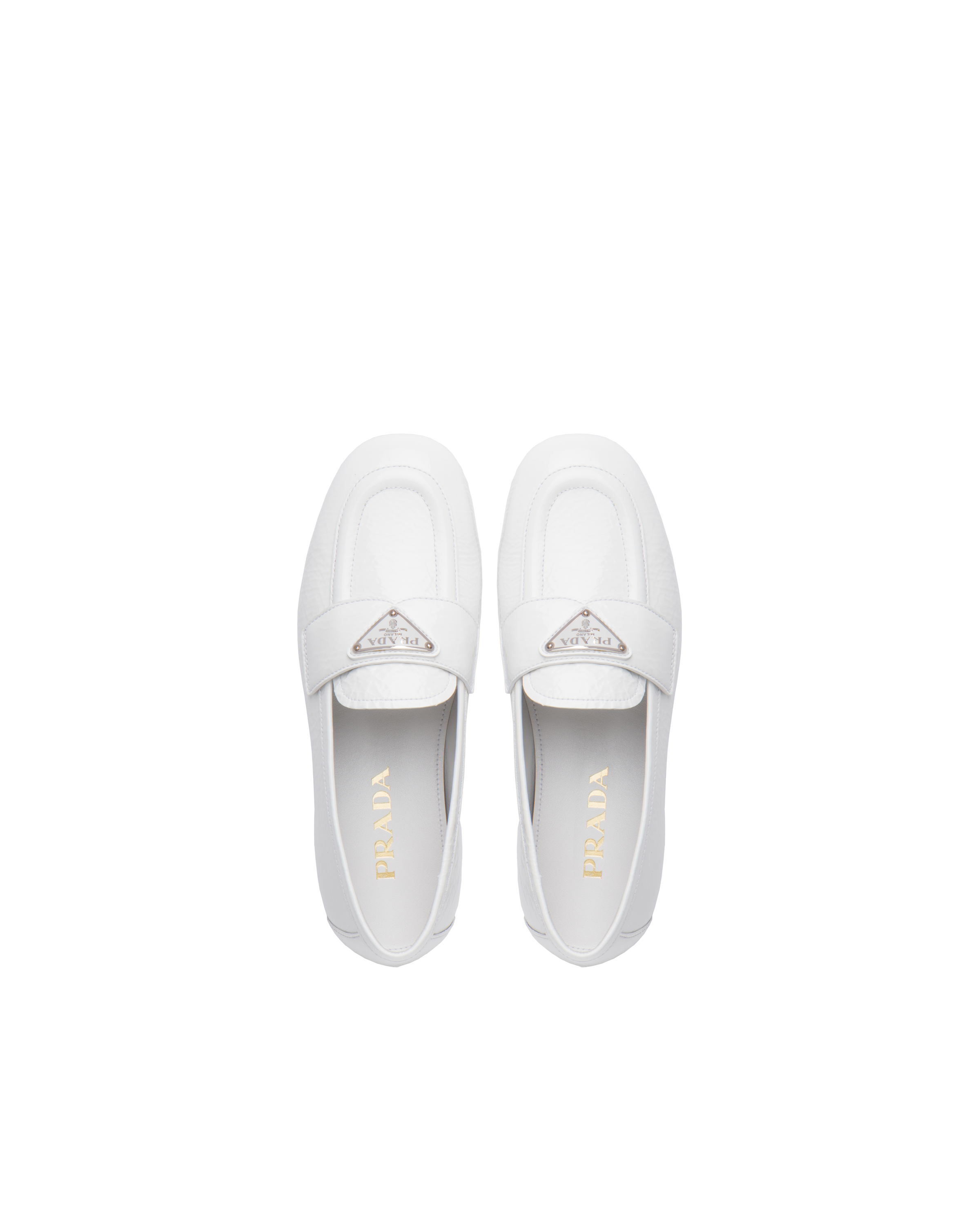 white prada loafers