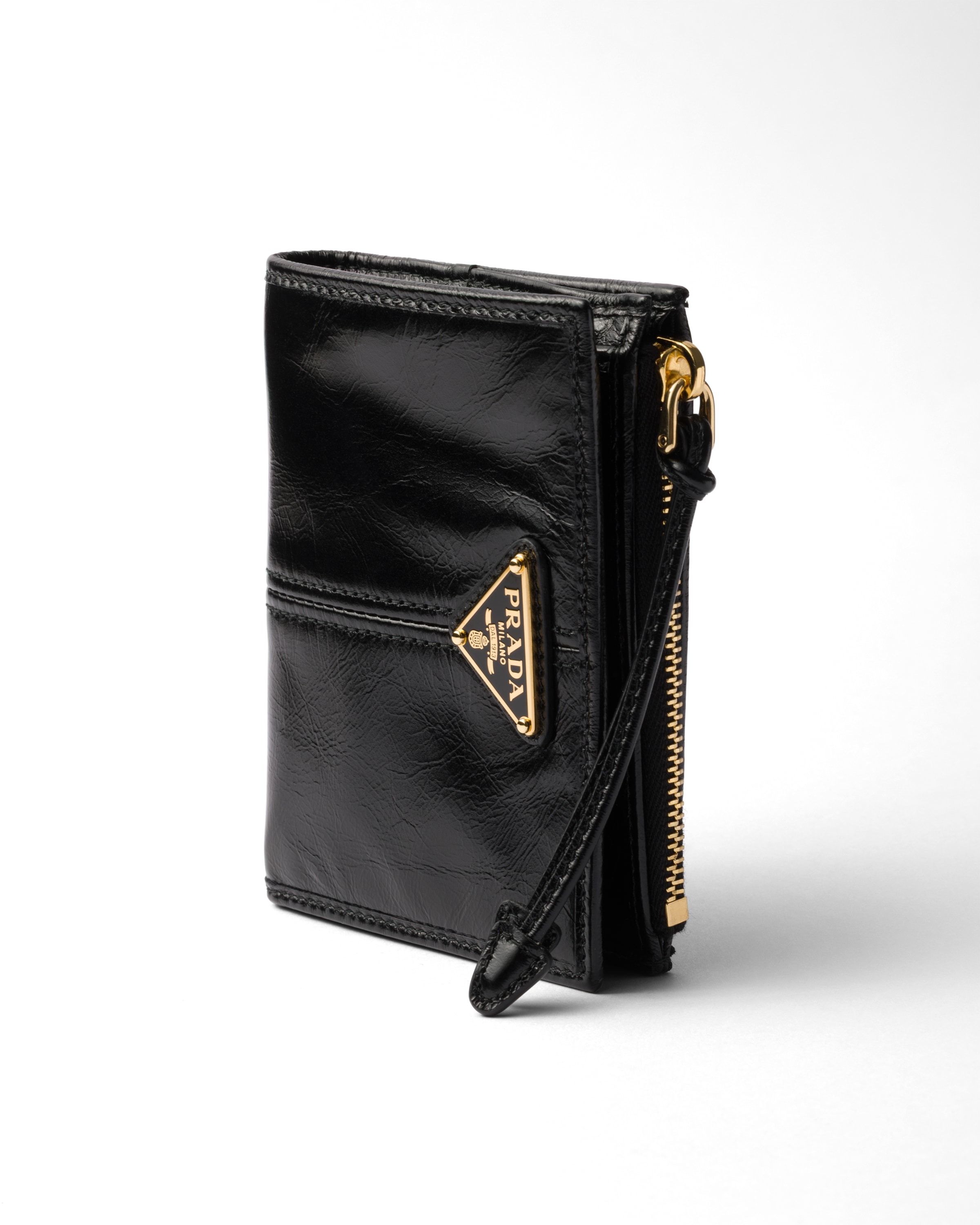 Prada Textured Leather Zip Wallet In Black