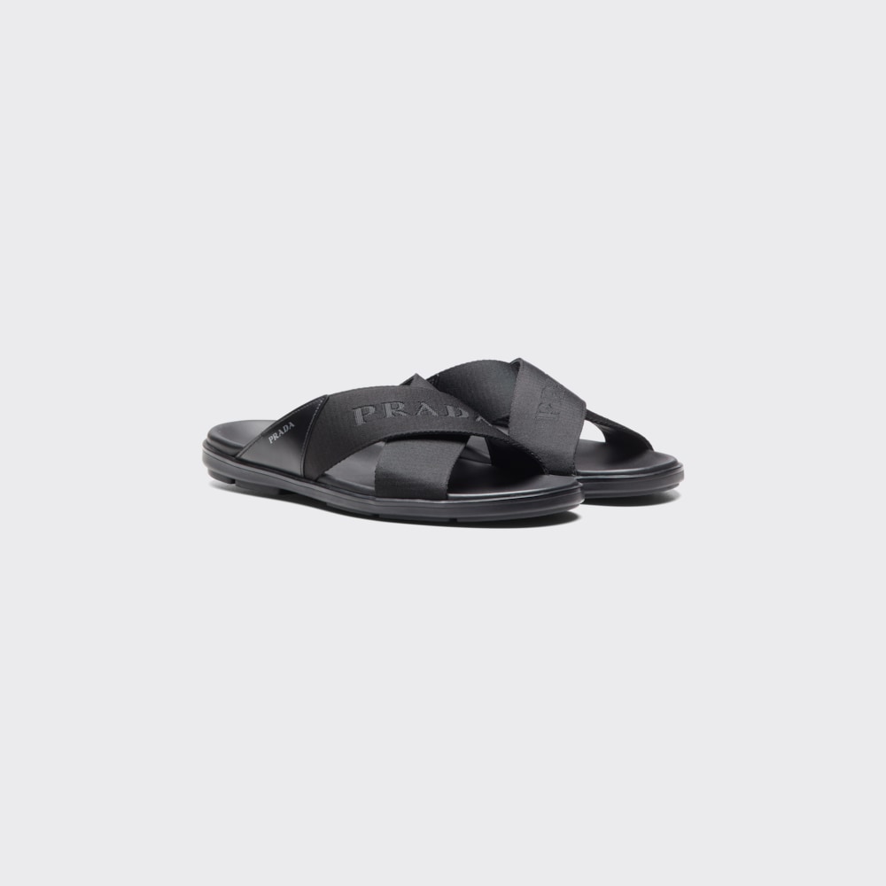 Black Brushed leather and nylon tape crisscross slides | Prada