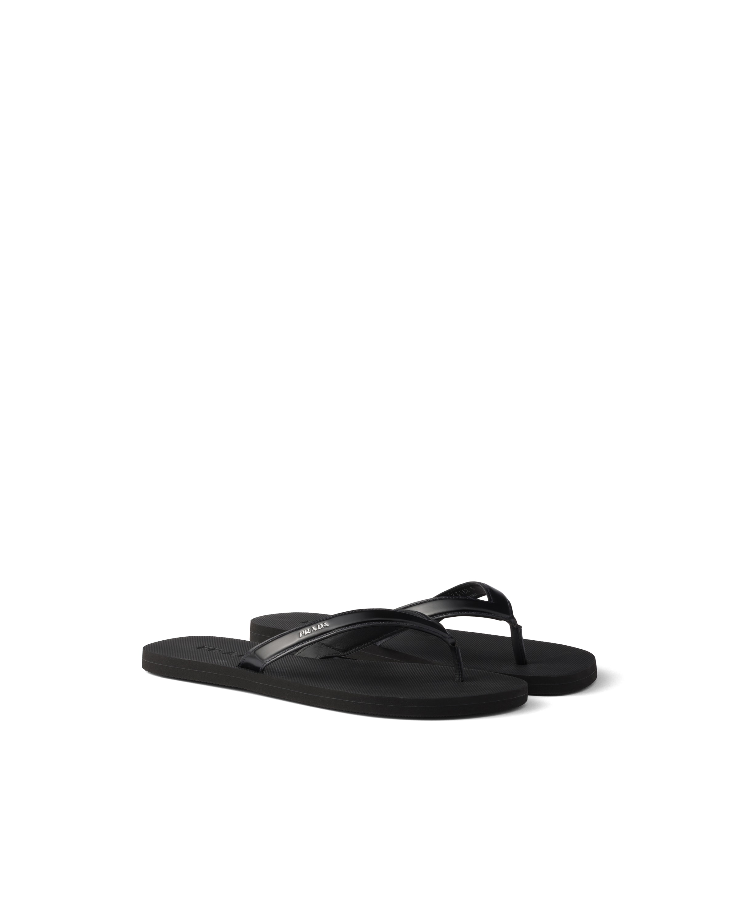 Prada Logo Embossed Leather Flip Flop Sandals In Black