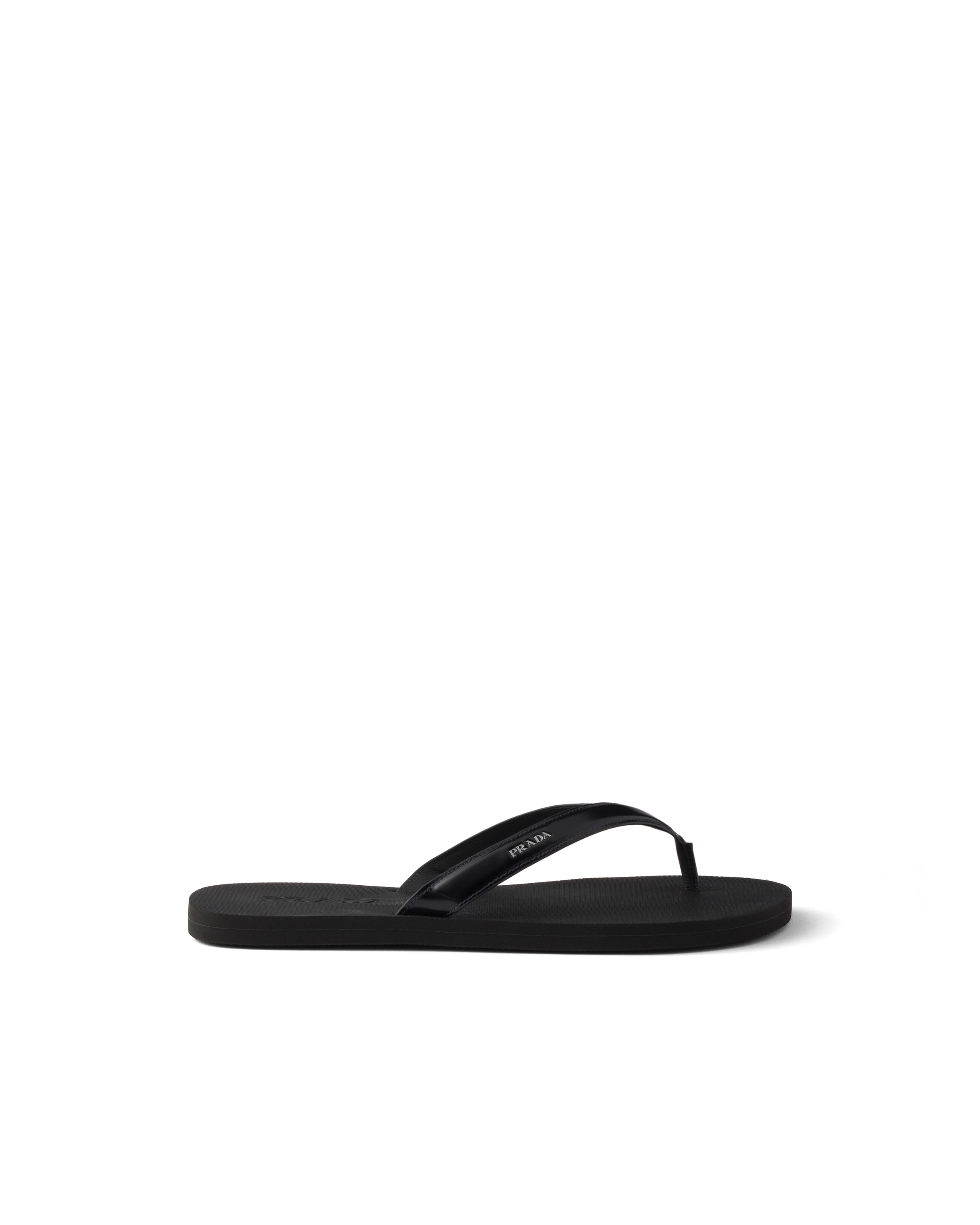 Prada Logo Embossed Leather Flip Flop Sandals In Black
