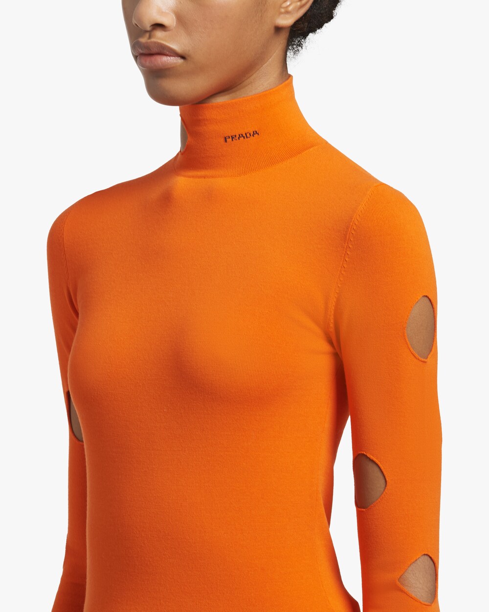 orange turtleneck top