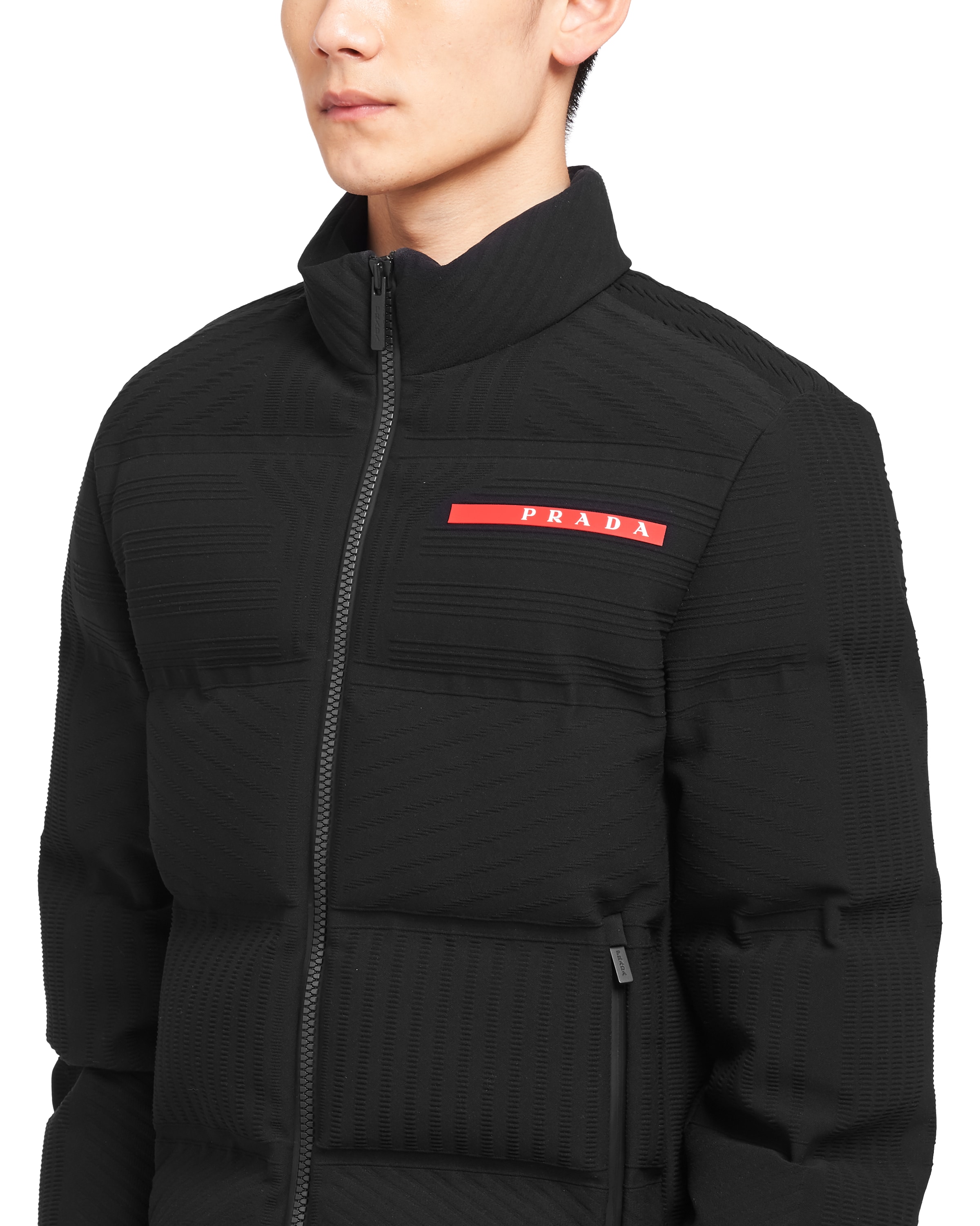 Cropped technical knit puffer jacket Prada